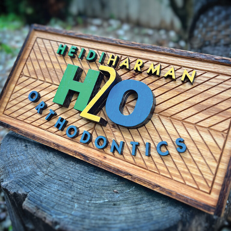 Custom wooden sign for an orthodontist in Kansas City