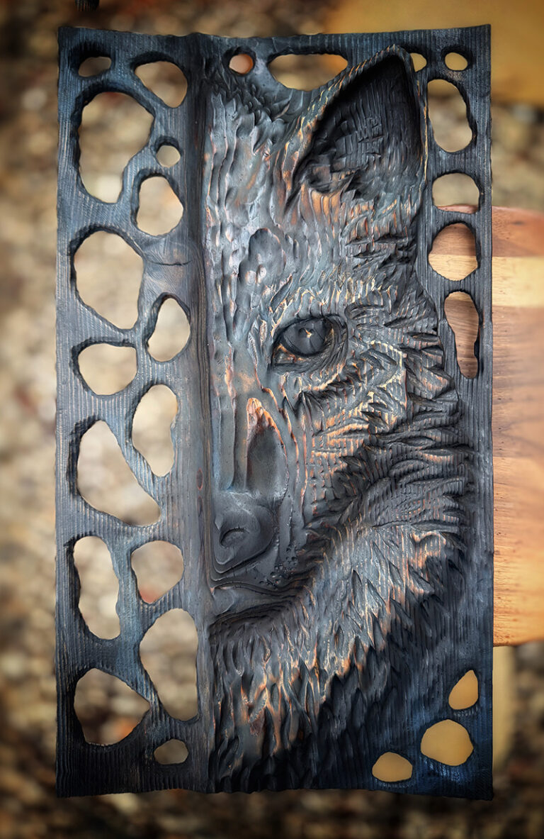 Hand carved portrait of the wolf
