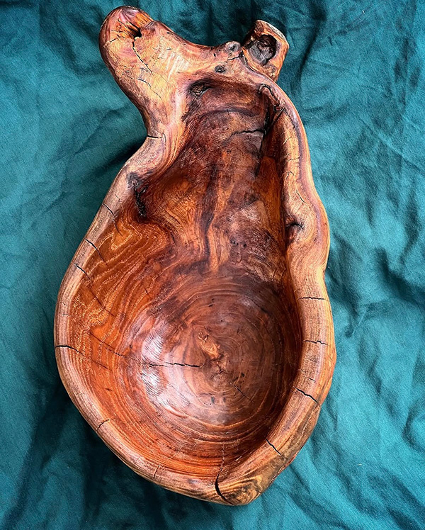 Hand-carved reclaimed wood sculpture of a human heart