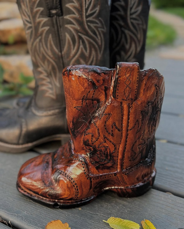 Hand-carved wooden cowboy boot vase