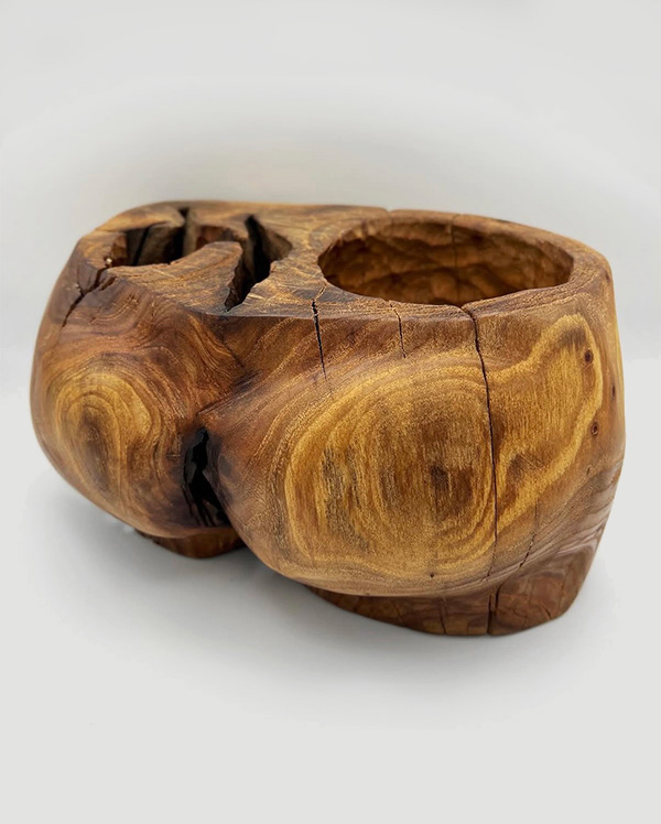 Wooden sculpture of a butt
